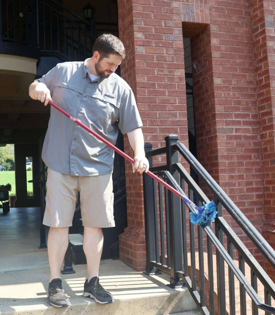 Dr. Chris Shumate cleans a rail.