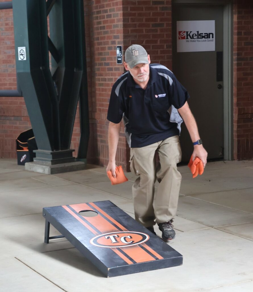 Max Olmstead tosses a cornhole bag.