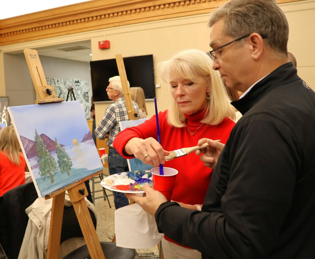 Dr. Scott Hummel, right, and Starr Hummel work on their painting.