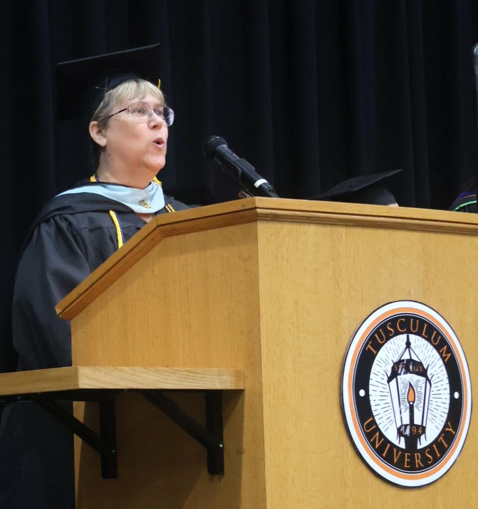 Jill Oberfeitinger sings the National Anthem.