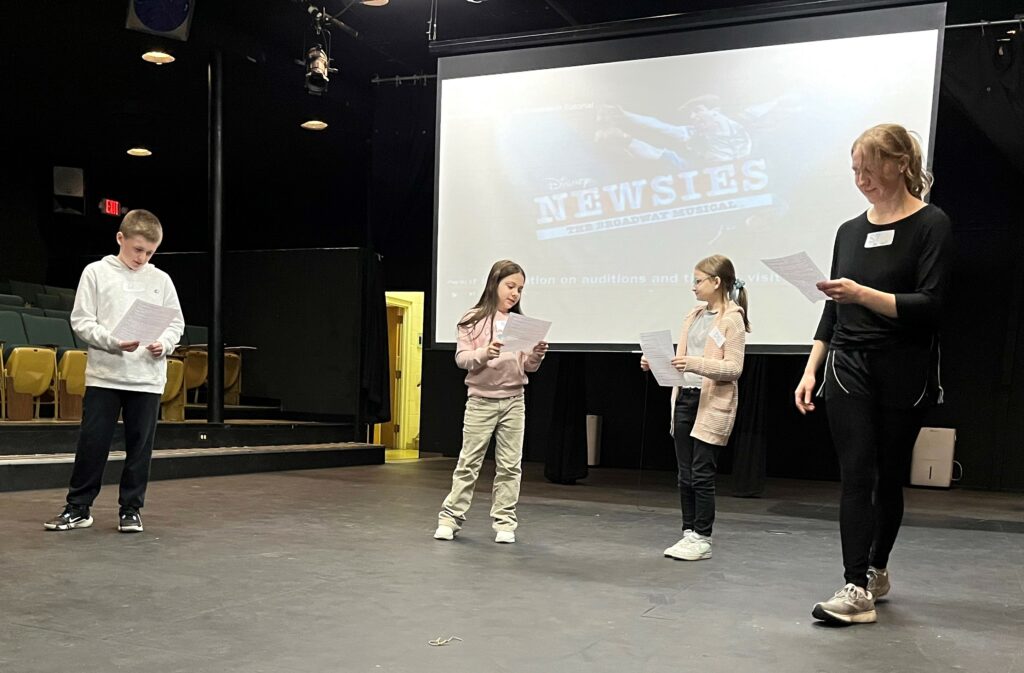 Potential cast members audition for "Newsies."