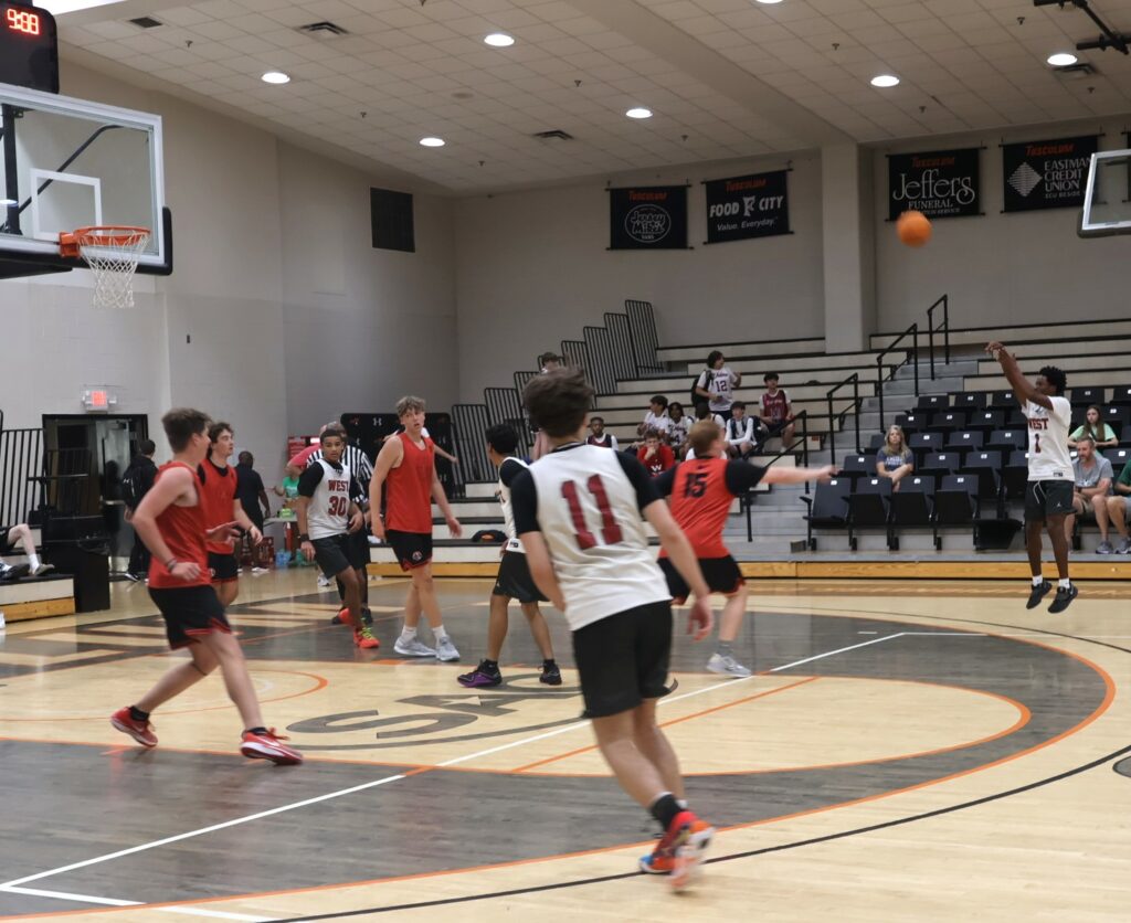 A player shoots a three-pointer.