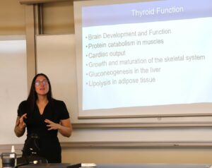 Katie Murphy makes her presentation “Environmental Toxins That Disrupt the Thyroid Gland.”