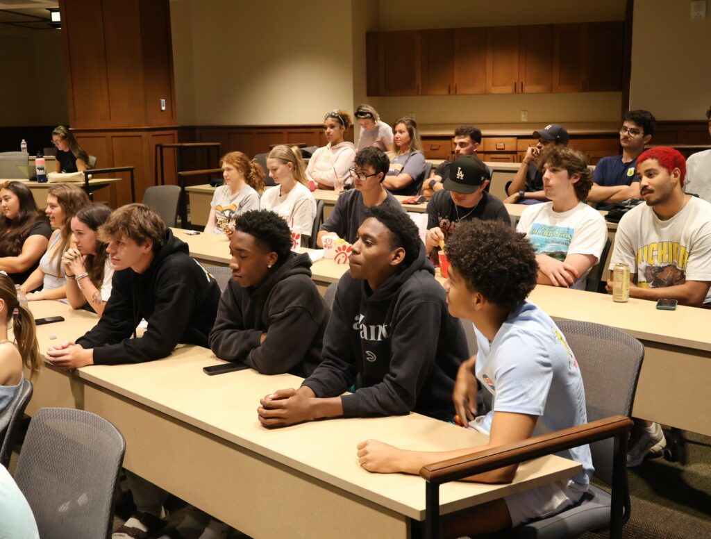 Students listen to the debate.