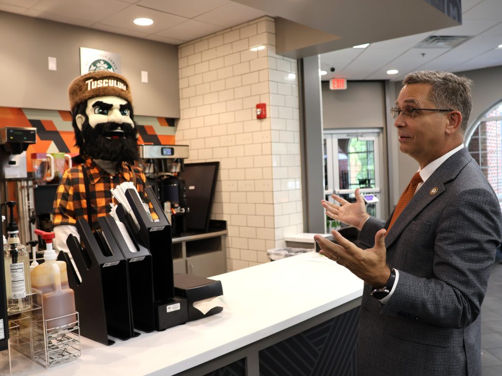 Dr. Hummel, right, prepares to order from Zeke.
