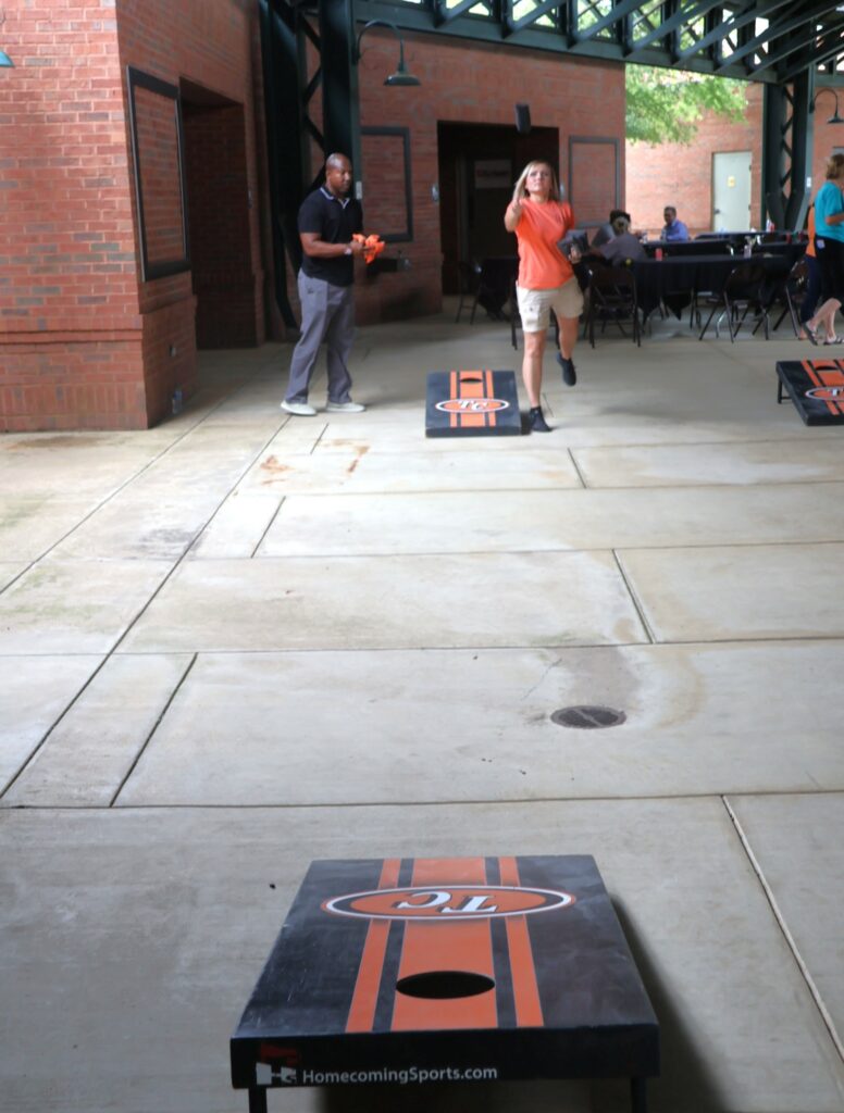 Tossing cornhole bags.
