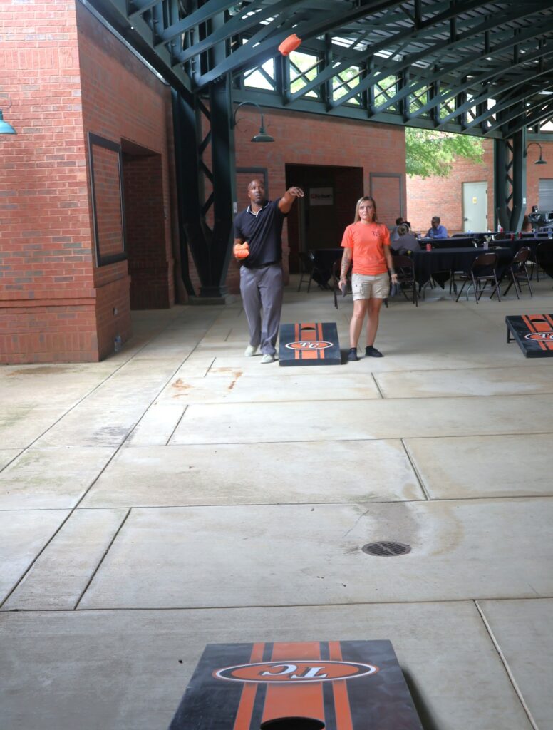 Tossing cornhole bags.