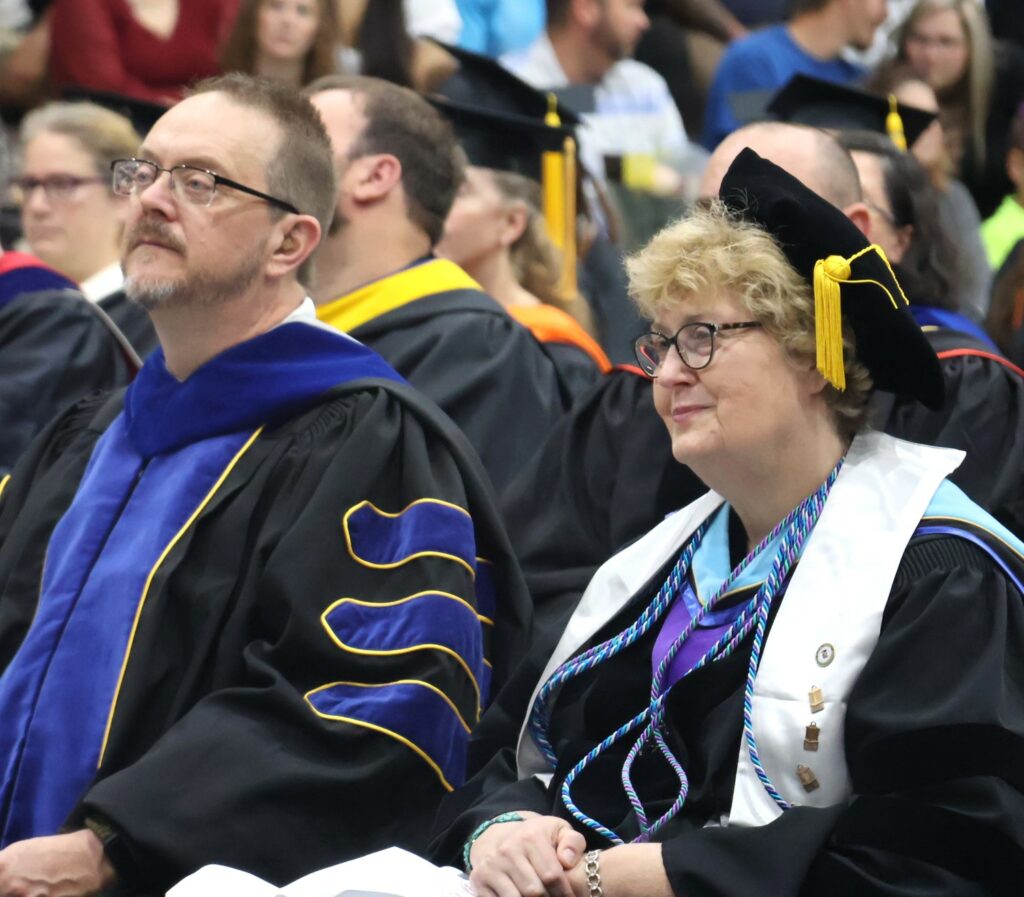 Dr. Jeff Burleson, left, and Dr. Peggy Goodson-Rochelle watch the proceedings.