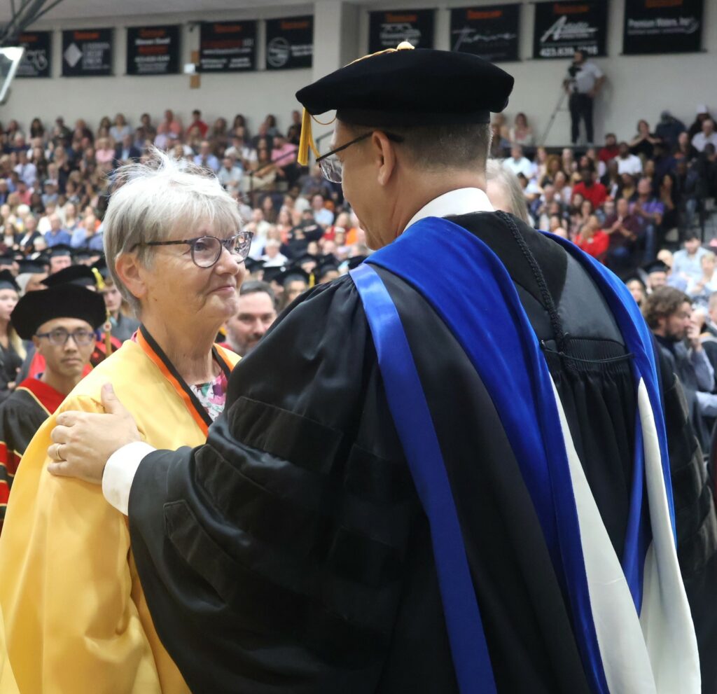 Dr. Hummel places a medallion on Barbara Davis McGavock.
