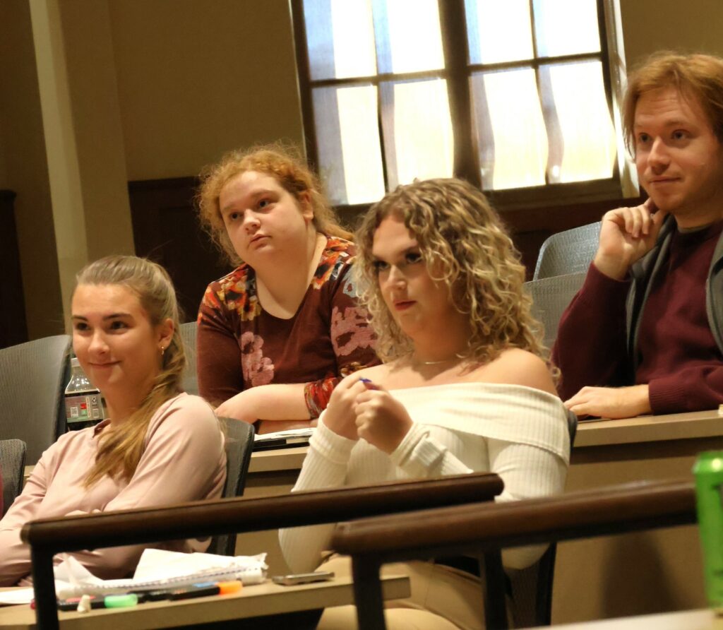 Students watch the debate.
