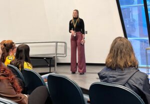 Tusculum graduate Cassie Born speaks with the students.