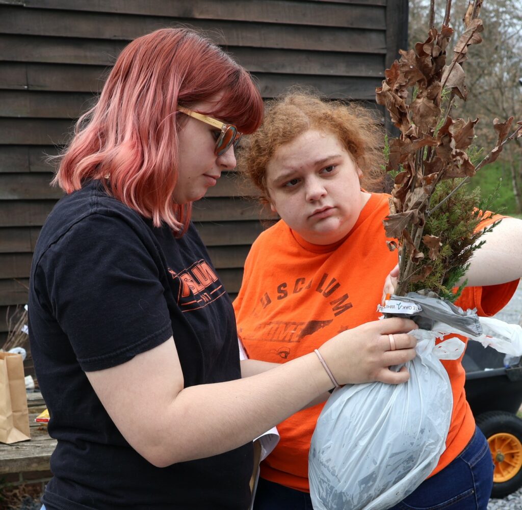 Hannah Morgan, left, and Zoey Seay process an order.