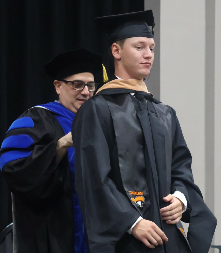 A student is hooded.