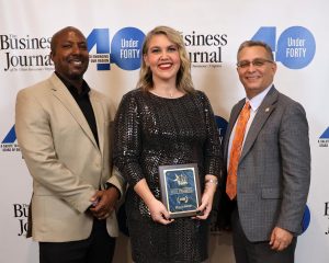 Erin Frizzell, middle, stands with Dr. Scott Hummel and her supervisor, Chuck Sutton.