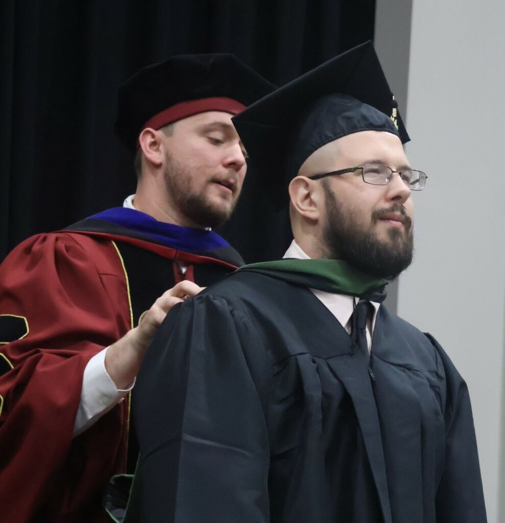 A student is hooded.