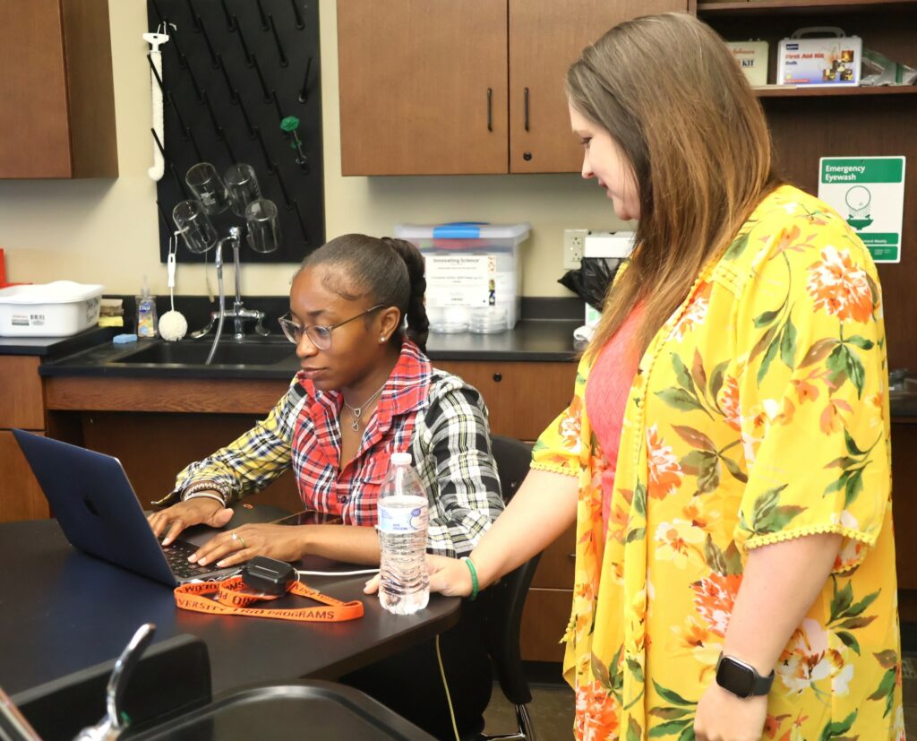 Dr. Danielle Shackelford, right, who teaches the marine biology class, takes a break.