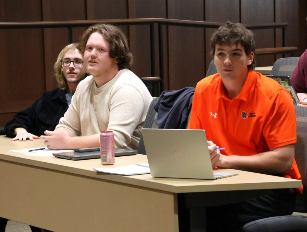 Students watch the debate.