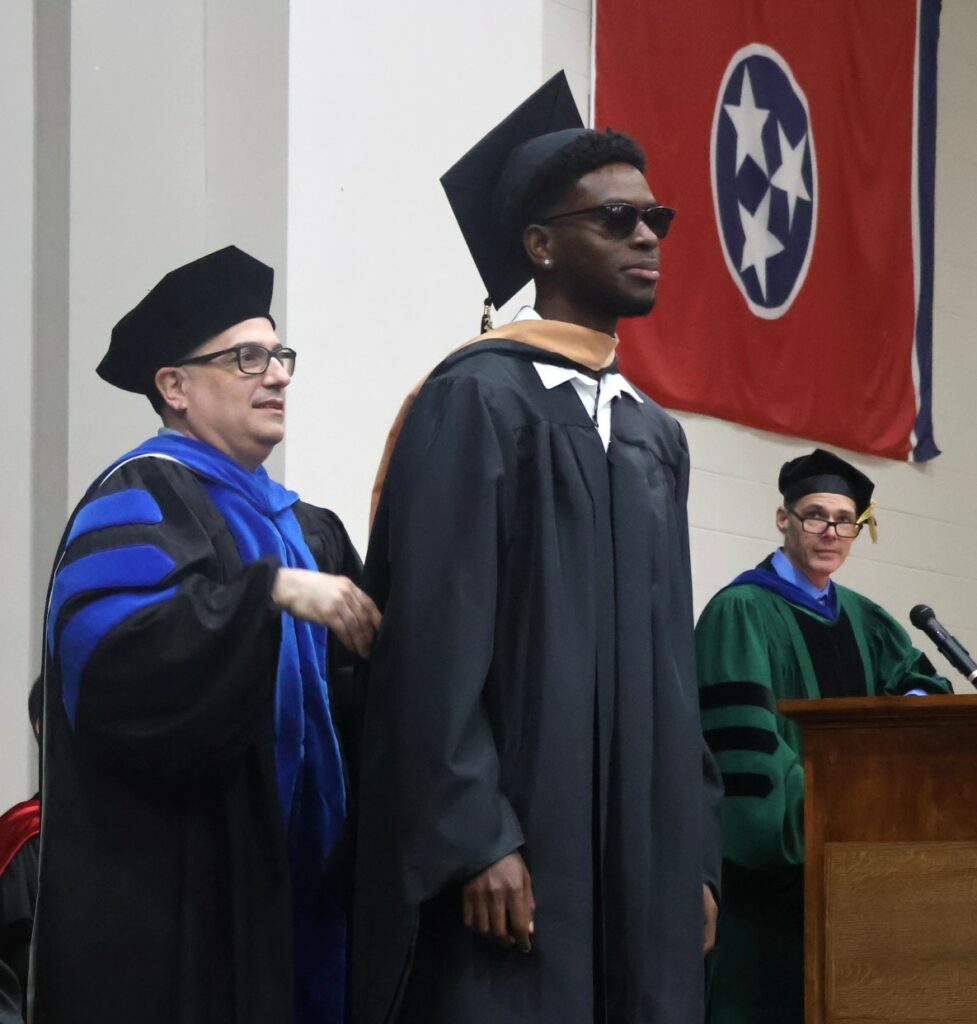 A student is hooded.