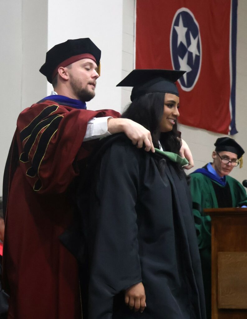 A student is hooded.