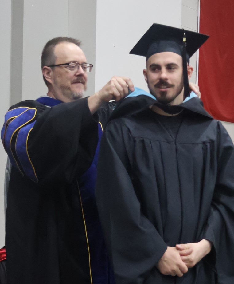 A student is hooded.