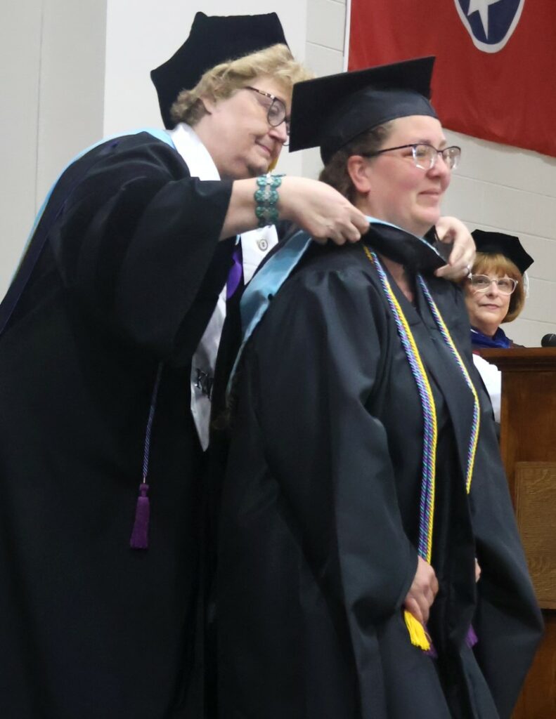 A student is hooded.
