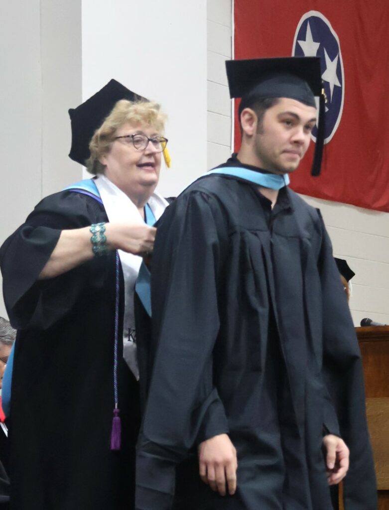 A student is hooded.