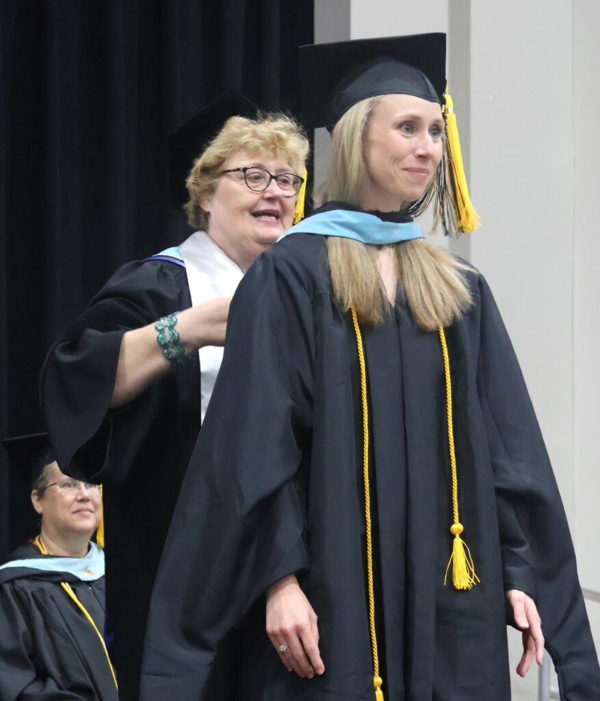 A student is hooded.