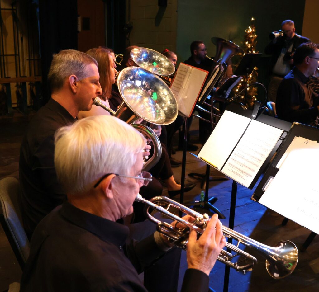 Band members practice before the concert starts.