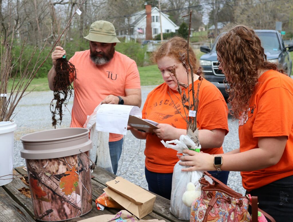 Left to right, Dr. Peter Noll, Zoey Seay and Savannah Webb work on an order.