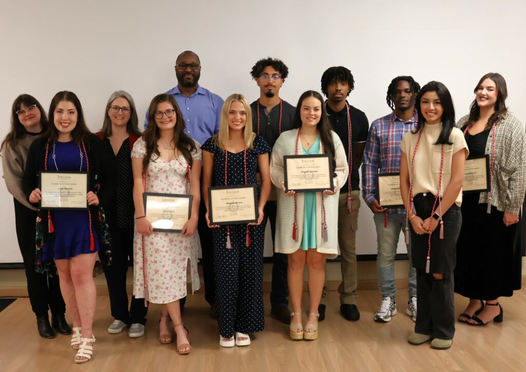 Student participants in the SSS program who are graduating pose with their certificates pose with staff members. Left to right are Meagan Stark, Josie Norton, Rachael Barnett, Kori Clark, Steve Anderson, Morgan Brown, Stefaan Forbes, Angela Sanchez, Justin Rogers, Cameron Sanders, Maria Torres and Jessica Silvers. 