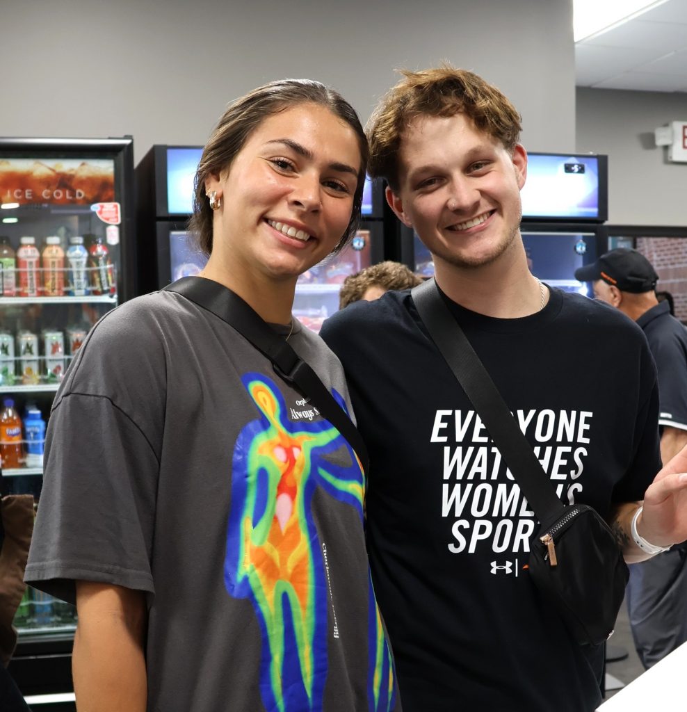 Two students prepare to eat buy something at Zeke's.