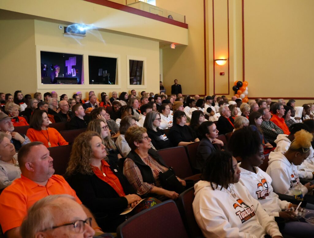 A large crowd enjoys the show.