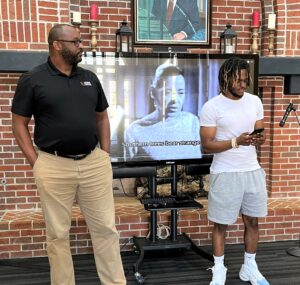 Tusculum staff member Steve Anderson, left, and student Andrae Robinson read “Life” by Paul Laurence Dunbar during the 2022 African American Read-In.
