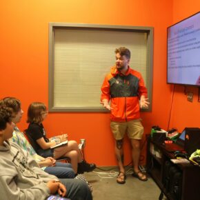 Dr. Nick Davidson, right, gives a lesson during the 2024 Esports and the Business of Video Games camp in 2024.