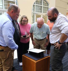 Tusculum University employees and community members look at the Greeneville College charter.
