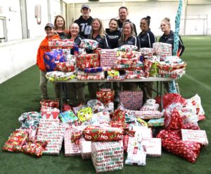 Members of Tusculum’s Facilities Management Department take a photo with the gifts going to foster children.