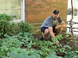 Justin Chartrand prepares to help clear an area outside Virginia Hall.