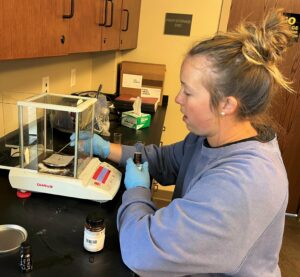 Student Keylon Reynolds works on the anti-cancer drug research project.