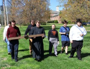 Students, faculty members and ministers participate in Stations of the Cross during Holy Week.