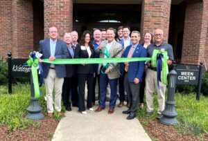 Dr. Scott Hummel, third from the right, participates in the ribbon cutting for the Watauga Orthopaedics clinic on campus.