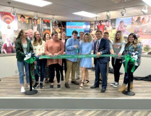 Tusculum students, faculty, staff and alumni as well as community leaders participate in the ribbon cutting for The Pioneer Perk. Dr. Scott Hummel is fourth from the right.