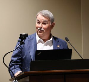 Dr. Greg Nelson delivers remarks.