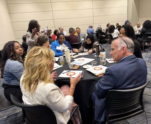 Dr. David Smith, wearing the suit in the foreground, participates in the institute in Kansas.