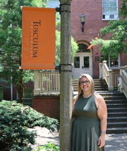 Erin Frizzell stands outside Virginia Hall.
