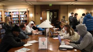 David Hite, second from the left among the seated, speaks with some of his students.