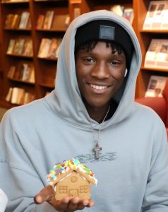 Xavier Bynoe shows the gingerbread house he created.