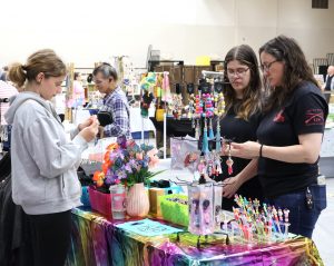 Attendees look at some of the merchandise in Pioneer Arena.