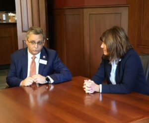 Dr. Scott Hummel, left, Tusculum’s president, makes comments during Congresswoman Diana Harshbarger’s visit.