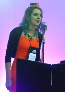 Alumna Erika Barker sings during the Alumni Dinner and Dance.