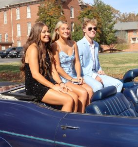 Homecoming court candidates ride in the parade.